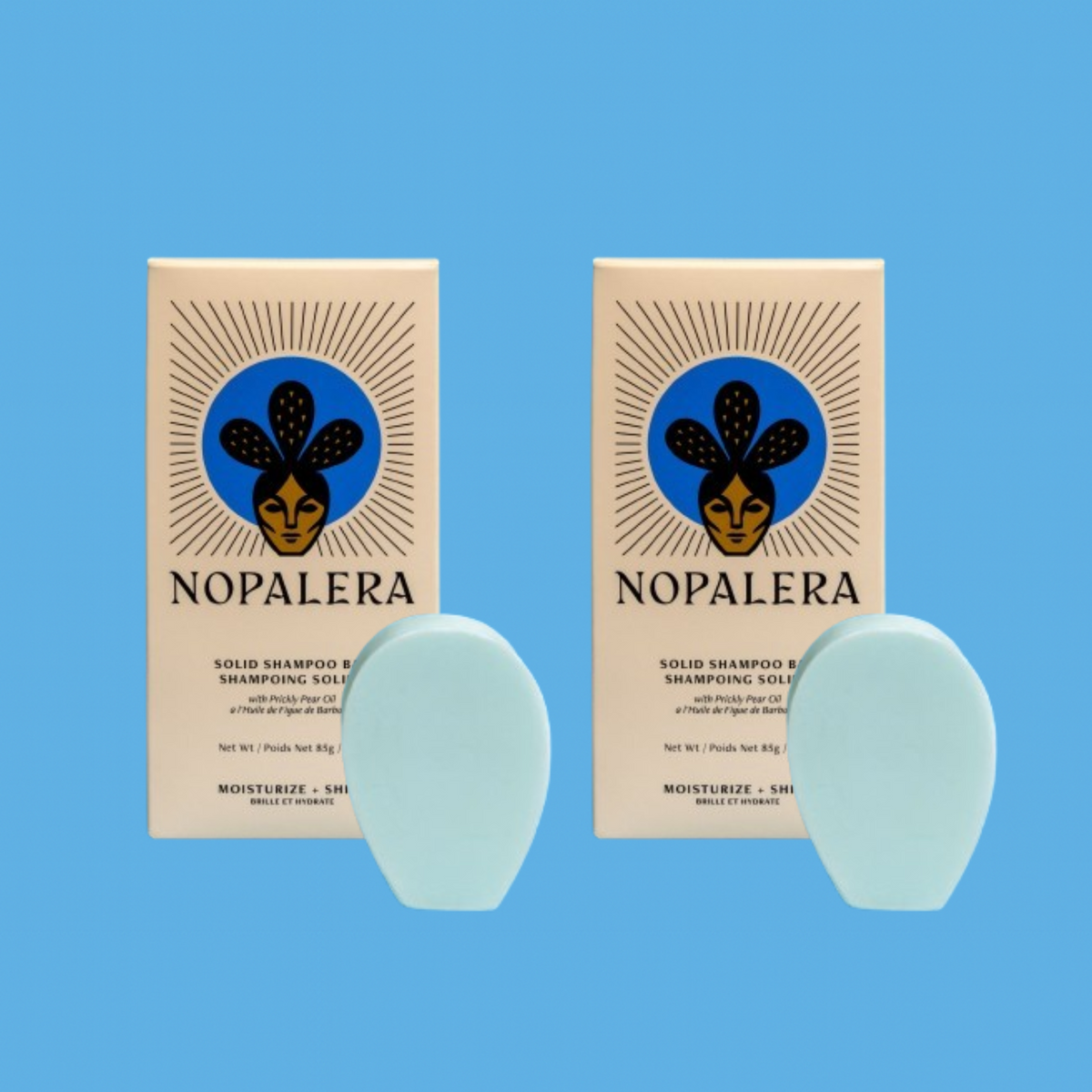 Two Nopalera solid shampoo bars with matching packaging against a blue background.