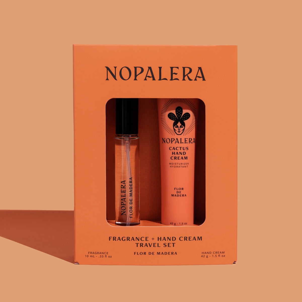 Nopalera Luxury Mexican Flor de Madera fragrance and hand cream travel set in an orange box on a beige background
