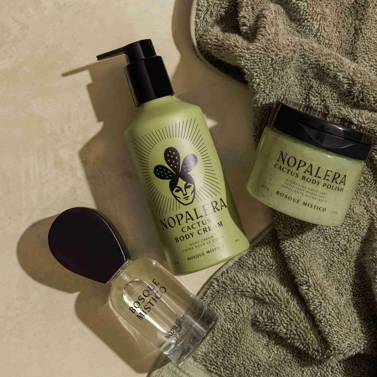 Nopalera cactus body care products on a green surface with a green towel.